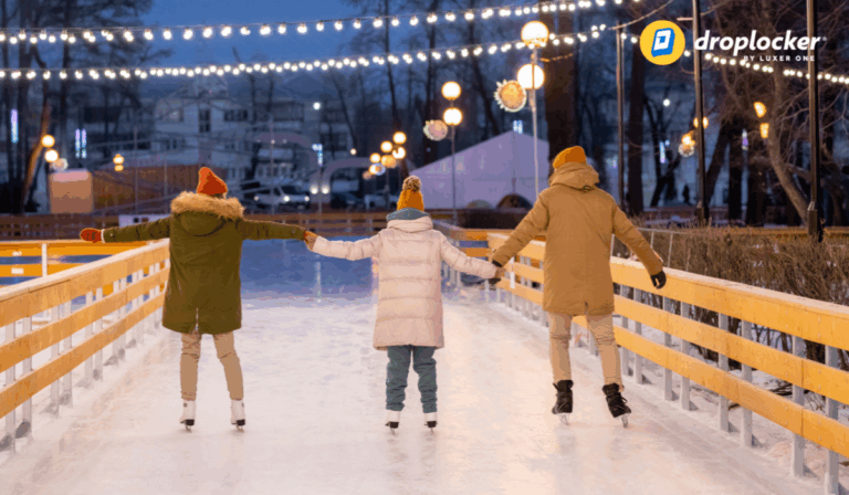 Family enjoying holiday ice skating rink in the winter